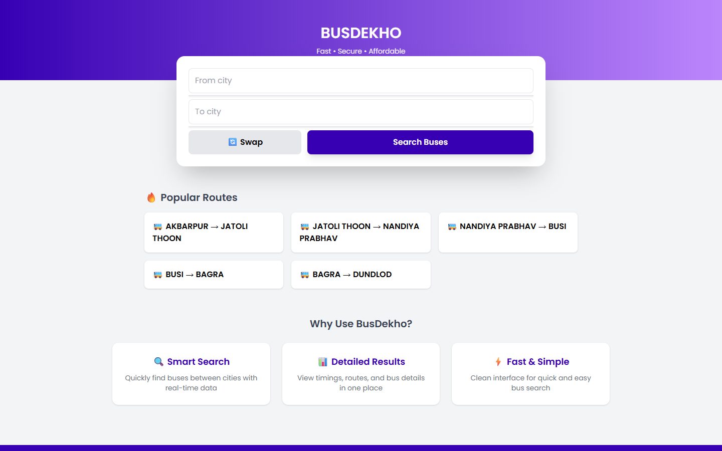 BusDekho website on a computer: from and to city search box with popular routes below